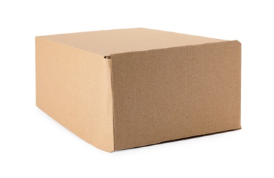 Closed cardboard box on white background. Mockup for design