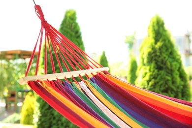 Photo of Colorful hammock outdoors on sunny summer day