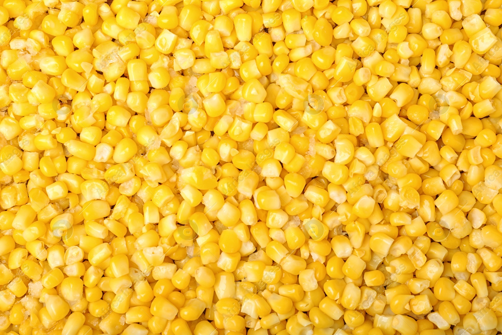 Photo of Frozen corn as background, top view. Vegetable preservation