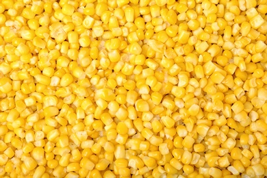 Photo of Frozen corn as background, top view. Vegetable preservation