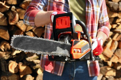 Photo of Man with modern saw on sunny day, closeup
