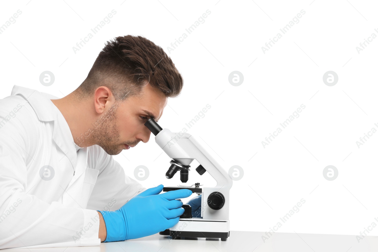 Photo of Scientist using modern microscope at table isolated on white. Medical research