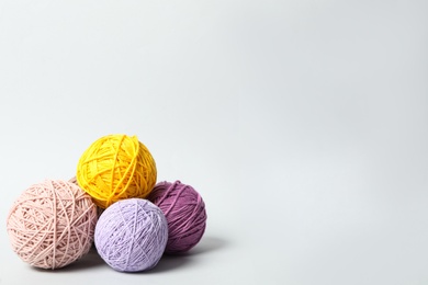 Soft colorful woolen yarns on white background