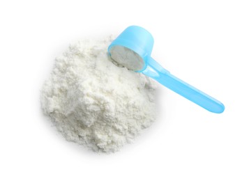 Photo of Powdered infant formula and scoop on white background, top view. Baby milk