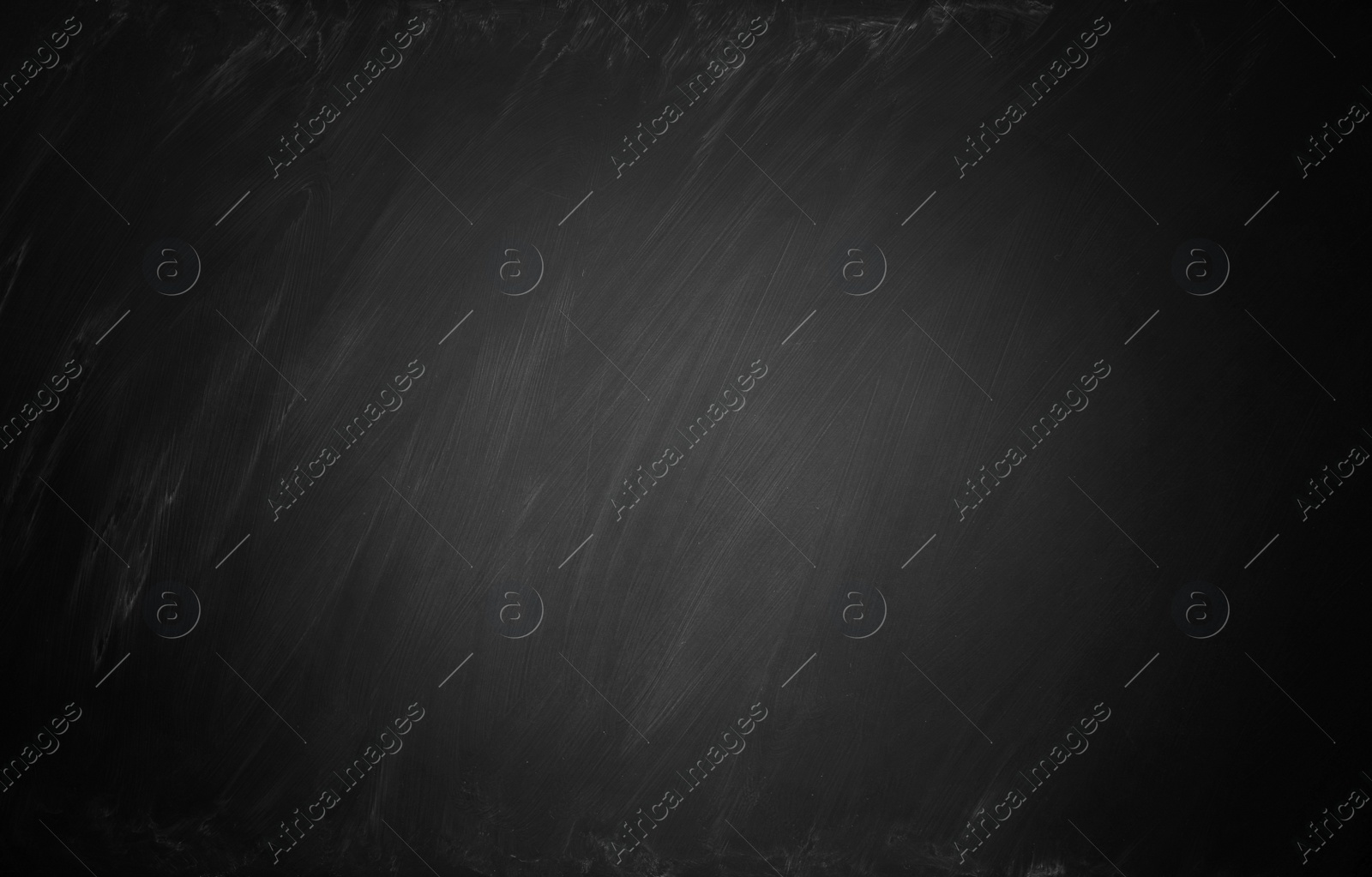 Image of Dirty black chalkboard as background. Vignette effect