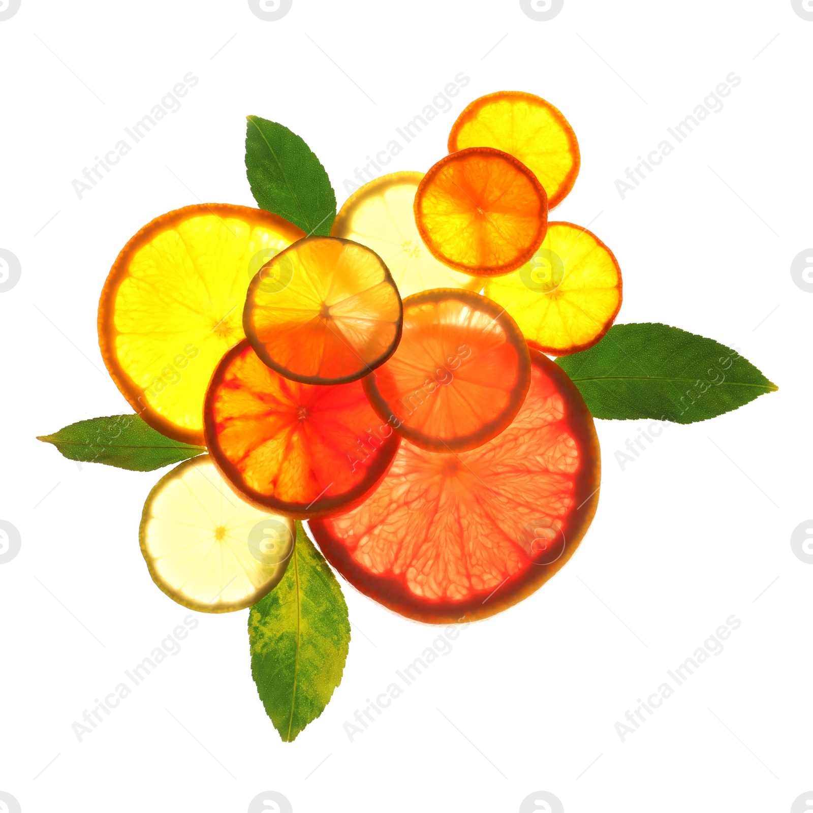 Photo of Illuminated slices of citrus fruits and leaves on white background, top view