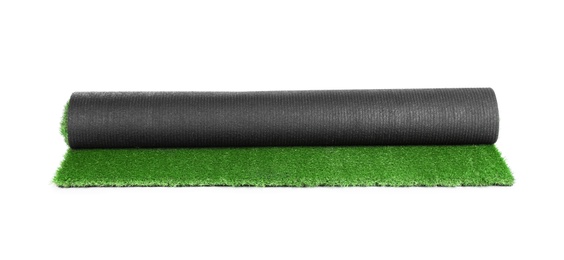 Photo of Rolled artificial grass carpet on white background. Exterior element