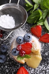 Photo of Tasty vanilla fondant with white chocolate and berries on table, closeup