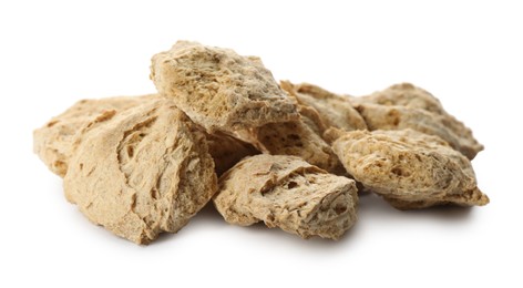 Photo of Dehydrated soy meat chunks on white background