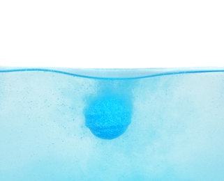 Photo of Bath bomb in water on white background