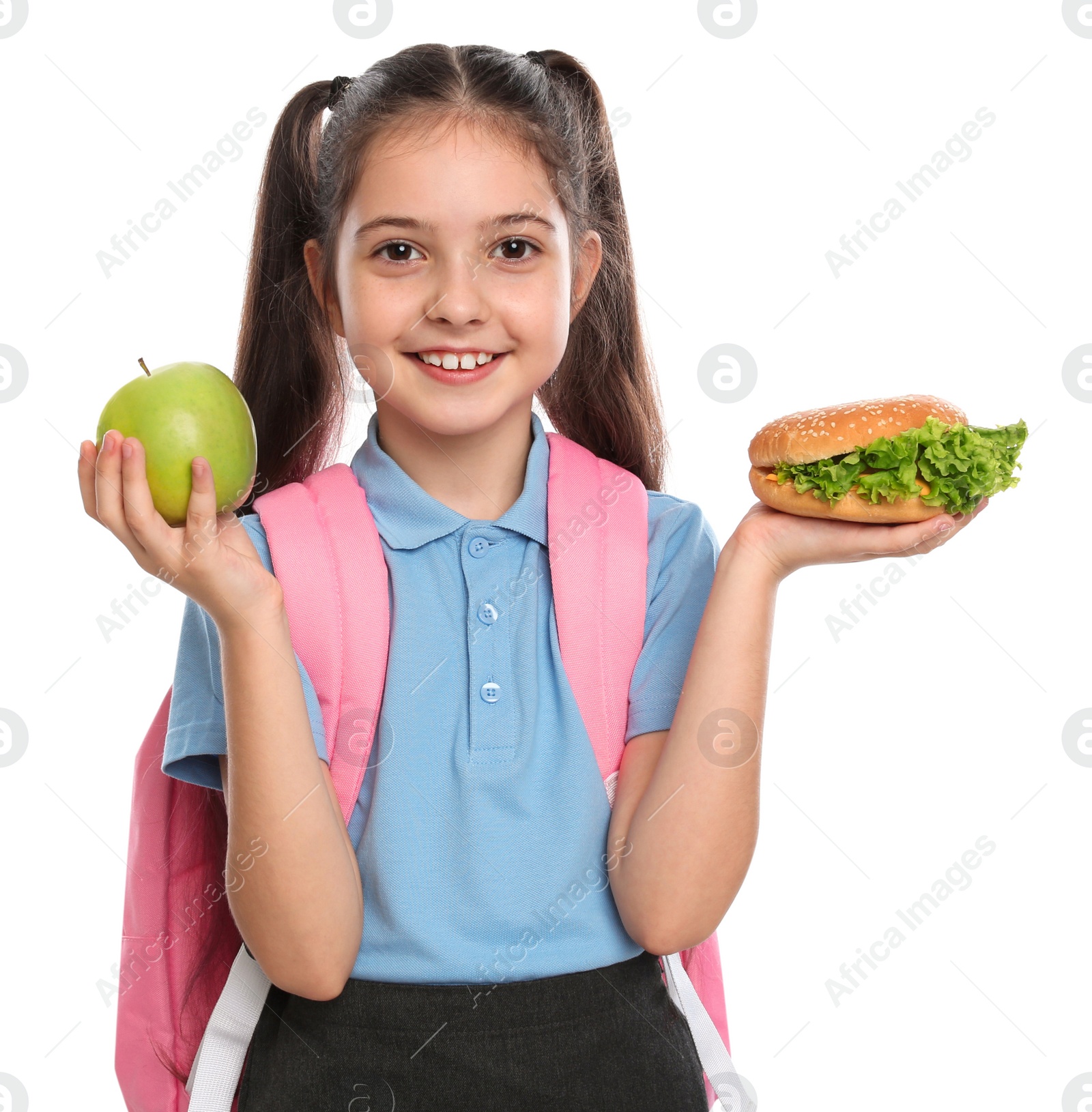 Photo of Happy girl with burger and apple on white background. Healthy food for school lunch
