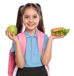 Happy girl with burger and apple on white background. Healthy food for school lunch