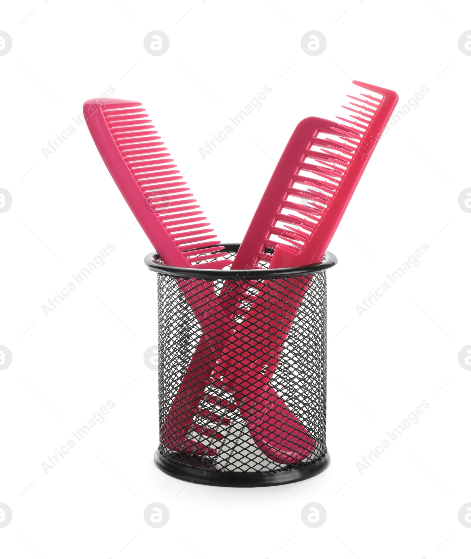 Photo of Set of professional hair combs in metal holder isolated on white