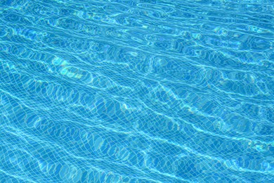 Photo of Clear refreshing water in swimming pool on sunny day, closeup