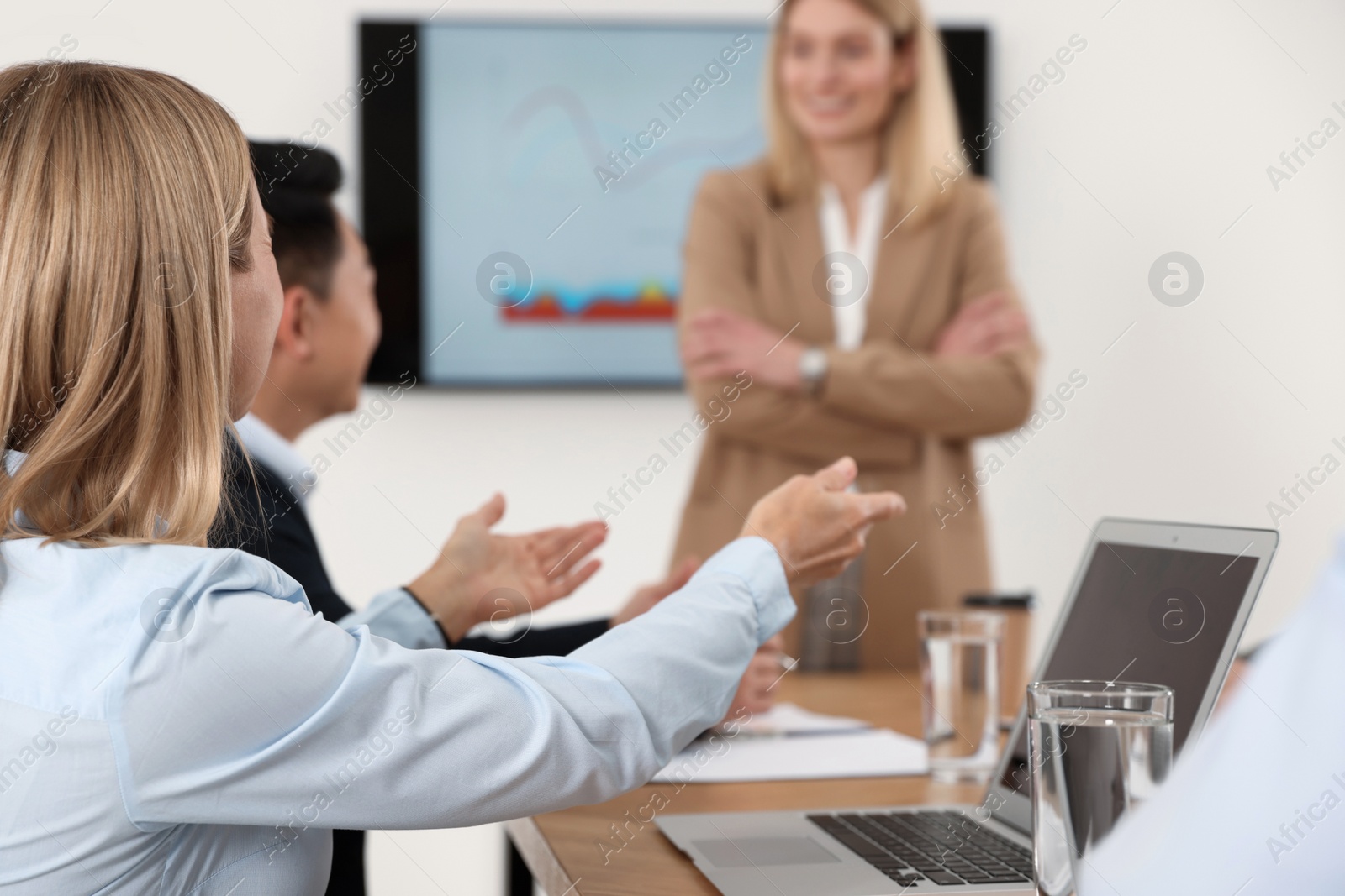 Photo of Businesswoman having meeting with her employees in office