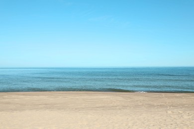 Photo of Picturesque view of sandy beach near sea