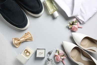 Wedding stuff. Flat lay composition with stylish boutonniere on light gray background, space for text