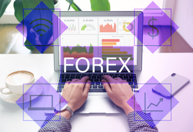 Woman working with laptop at table indoors, closeup. Forex trading