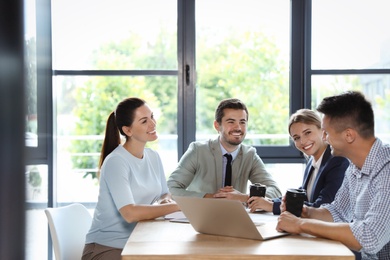 Photo of Office employees having business training at workplace