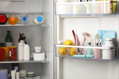 Photo of Different cosmetic products on shelves in refrigerator