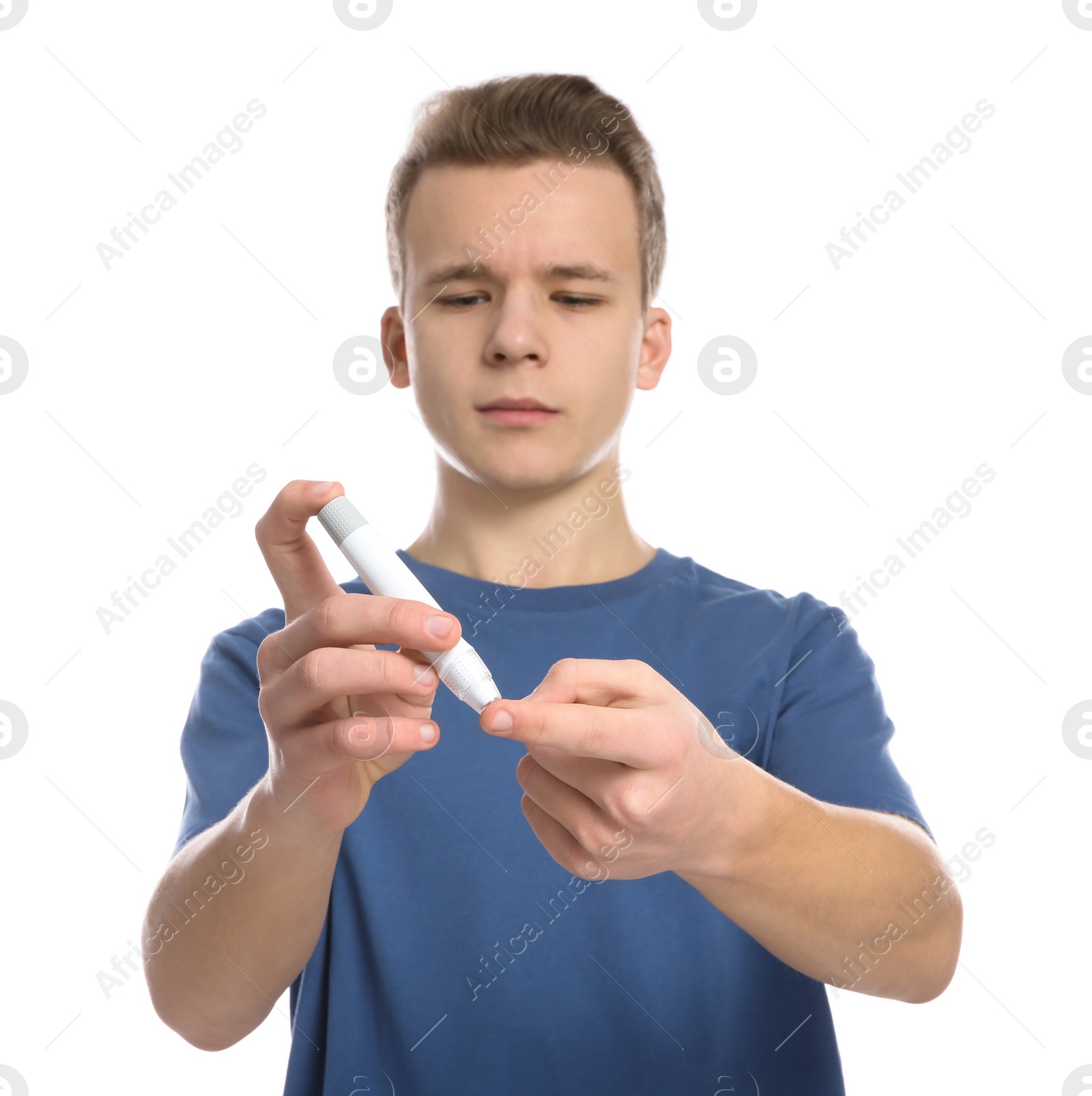 Photo of Teen boy using lancet pen on white background. Diabetes control