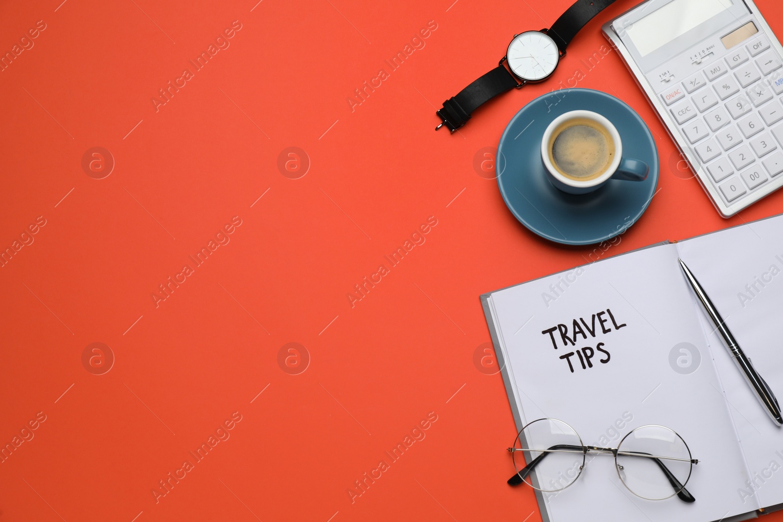 Photo of Notebook with phrase Travel Tips, coffee and office stationery on orange background, flat lay. Space for text