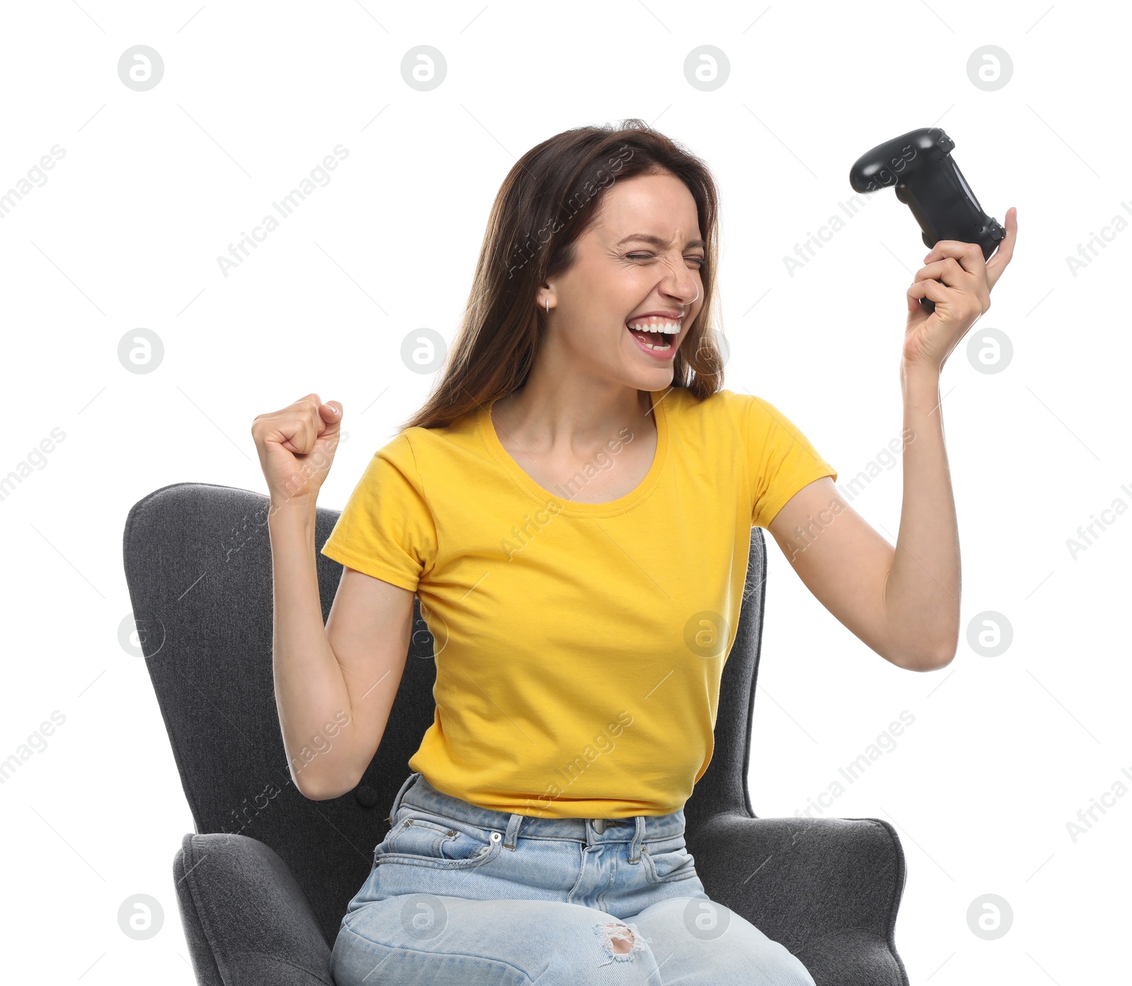 Photo of Happy woman with game controller sitting in armchair on white background