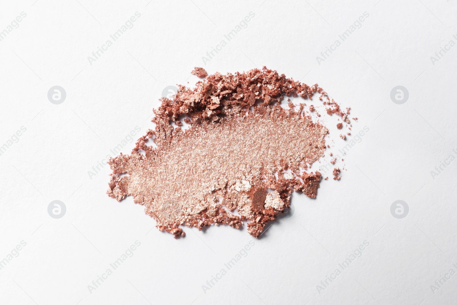 Photo of Crushed eye shadow on white background, top view. Professional makeup product