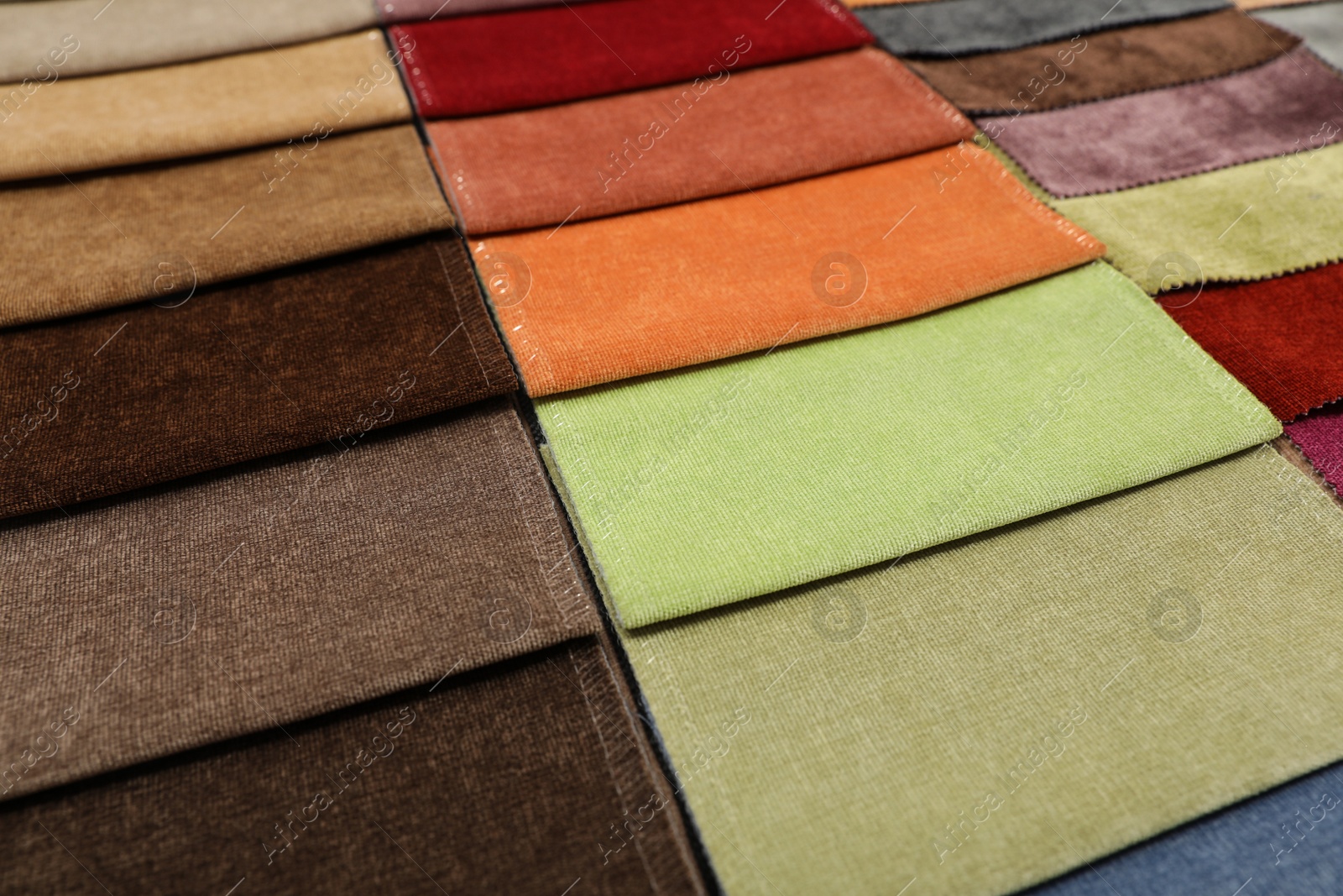 Photo of Fabric samples of different colors as background