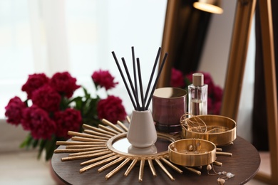 Photo of Composition with stylish accessories and interior elements on table indoors