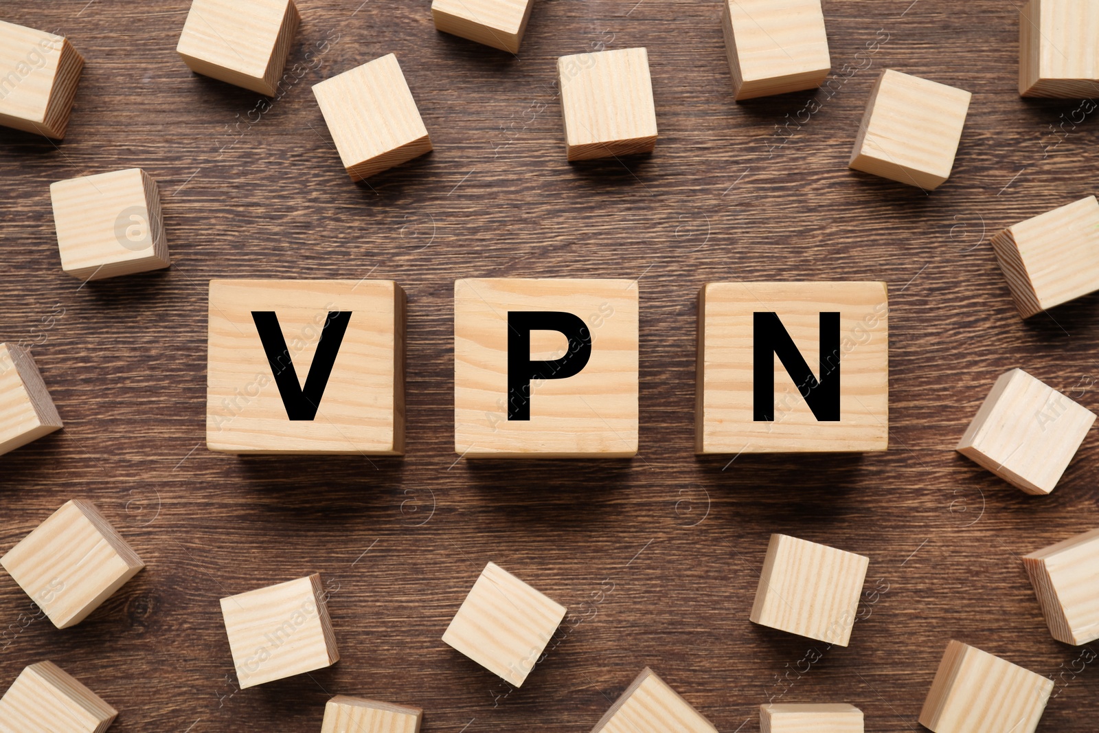Photo of Cubes with acronym VPN on wooden table, flat lay