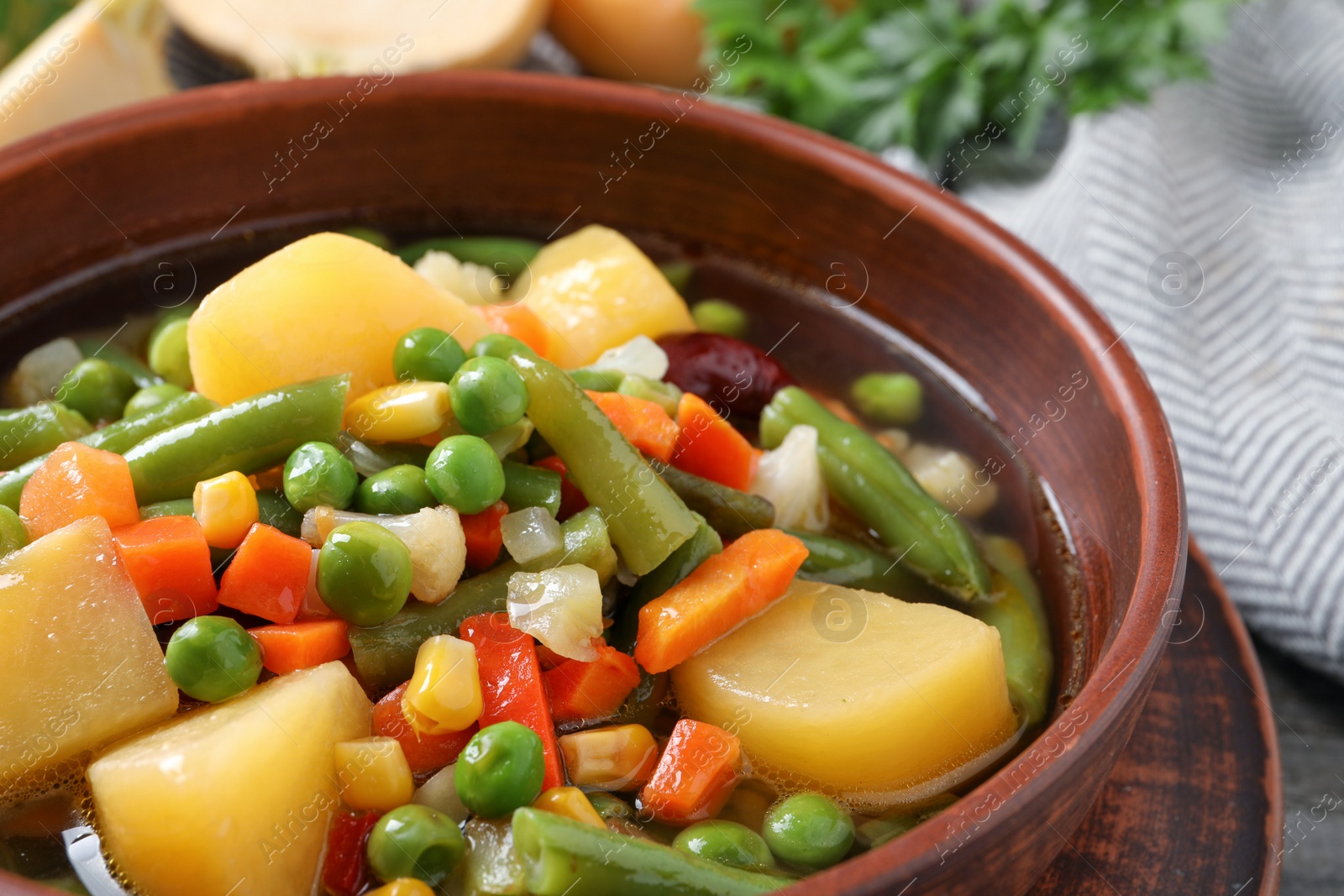 Photo of Bowl of delicious turnip soup, closeup view