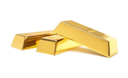 Photo of Precious shiny gold bars on white background