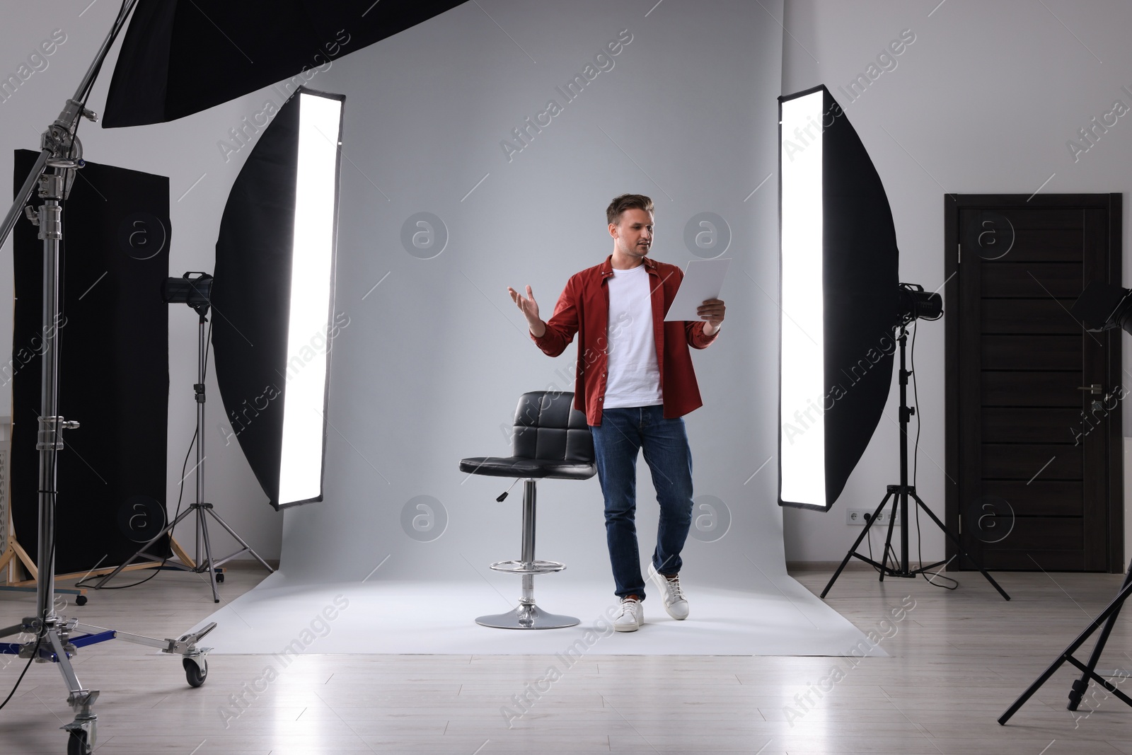 Photo of Casting call. Man with script performing in studio