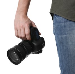 Photographer holding modern camera on white background, closeup