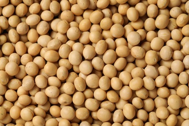 Heap of soy as background, top view