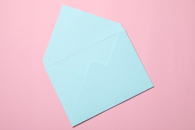 Photo of Letter envelope on pink background, top view