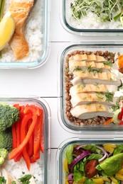 Healthy meal. Containers with different products on white wooden table, flat lay