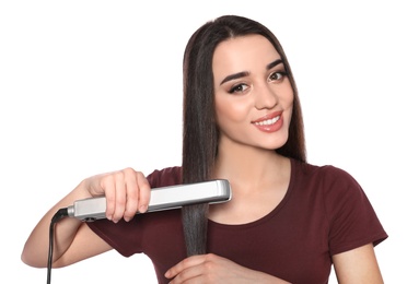 Photo of Happy woman using hair iron on white background