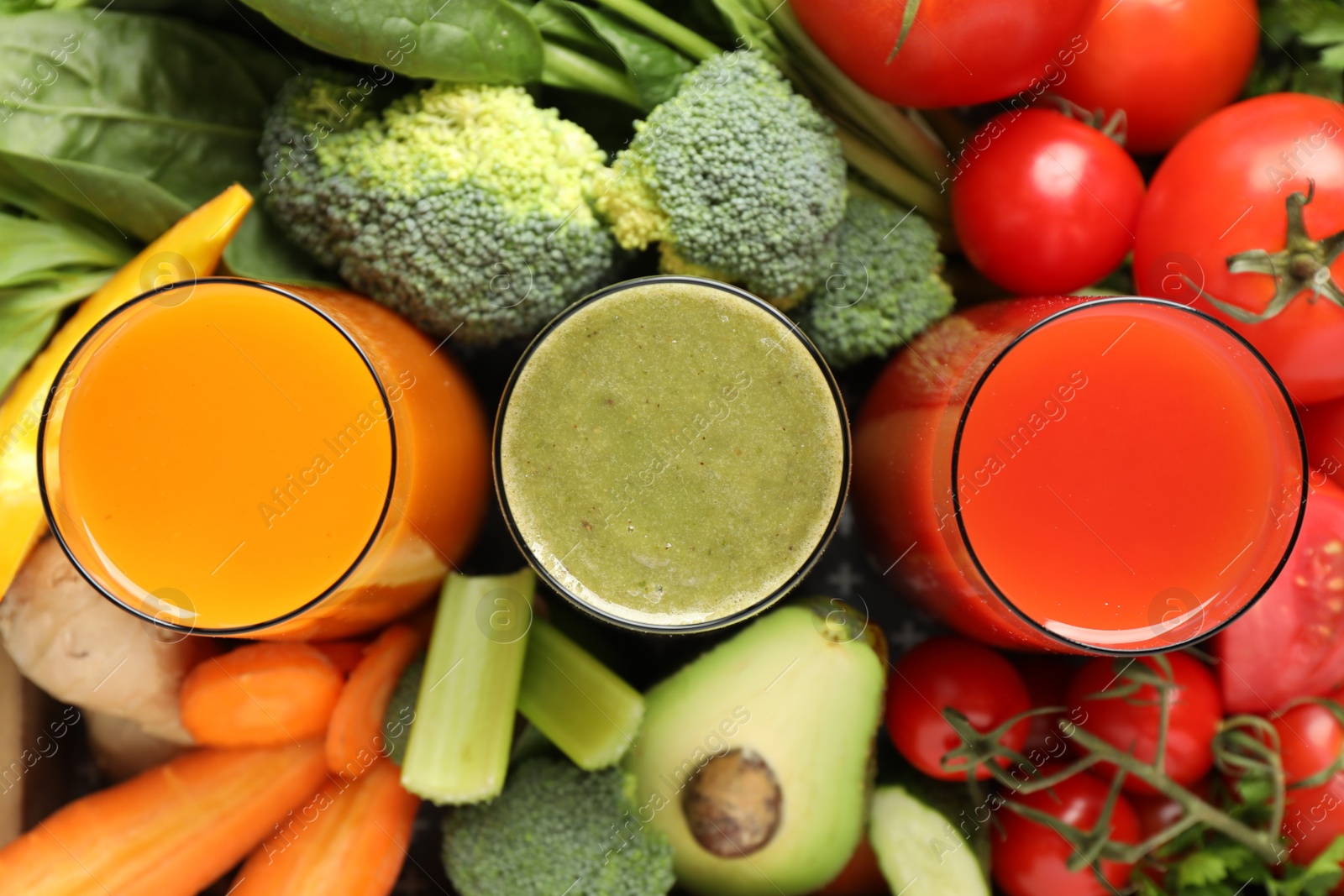 Photo of Delicious vegetable juices and fresh ingredients as background, top view