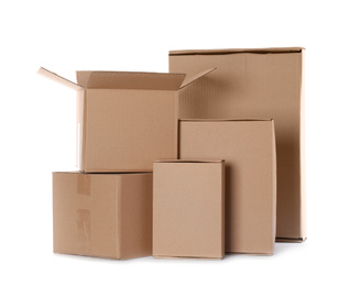 Photo of Many different cardboard boxes isolated on white