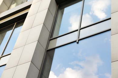 Modern office building with tinted windows. Urban architecture