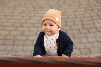 Portrait of cute little baby in park
