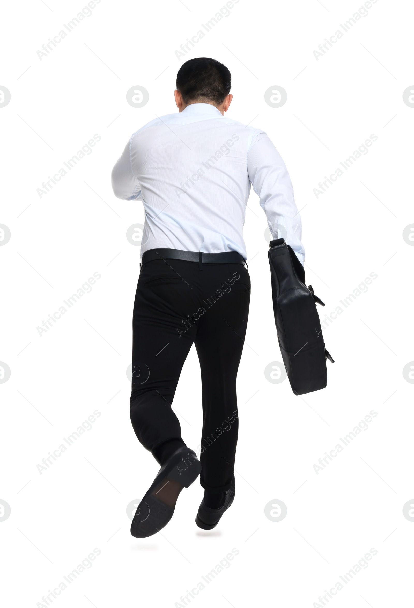 Photo of Businessman with briefcase running on white background, back view