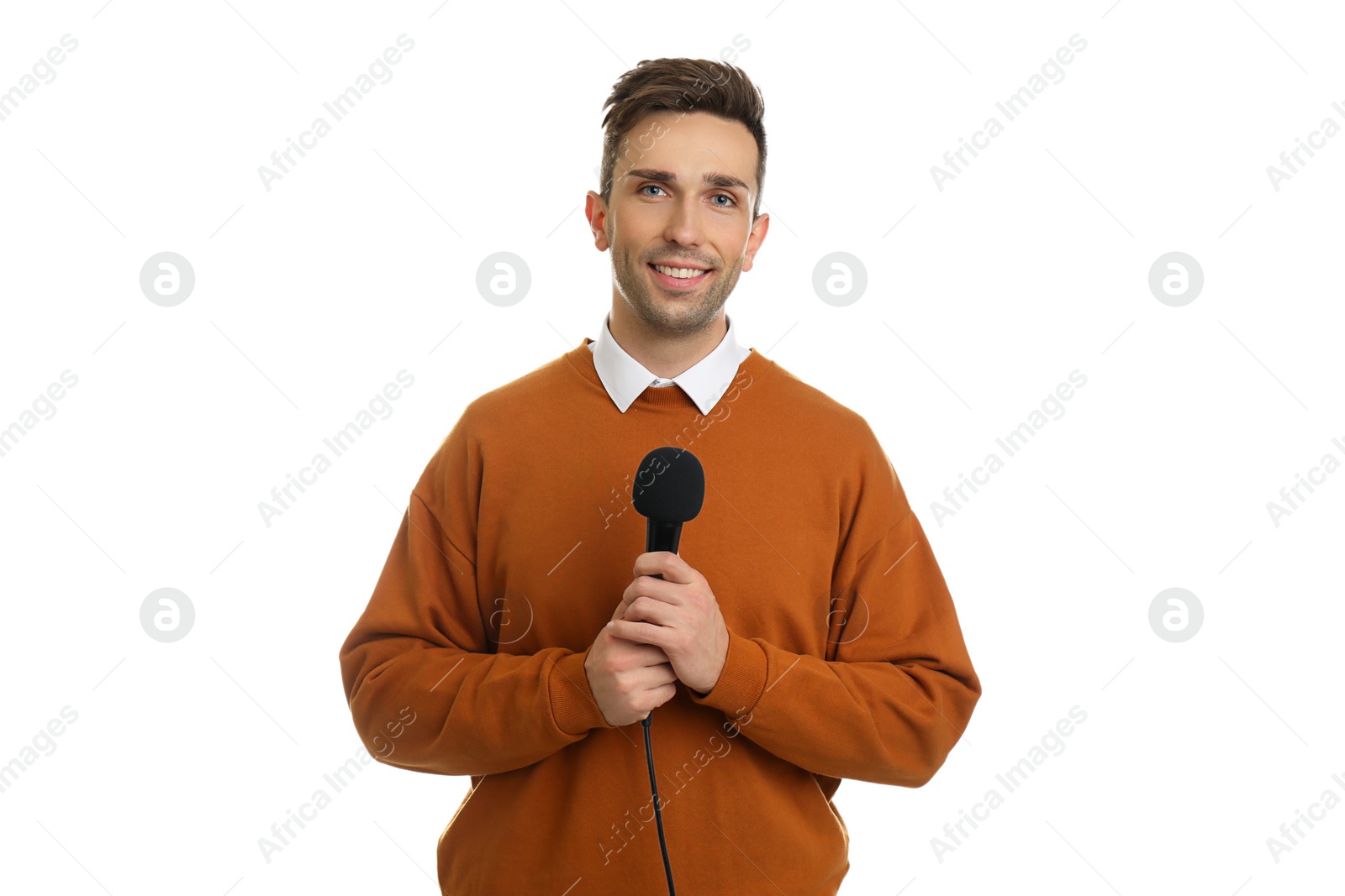 Photo of Young male journalist with microphone on white background