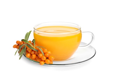 Photo of Sea buckthorn tea and fresh berries isolated on white