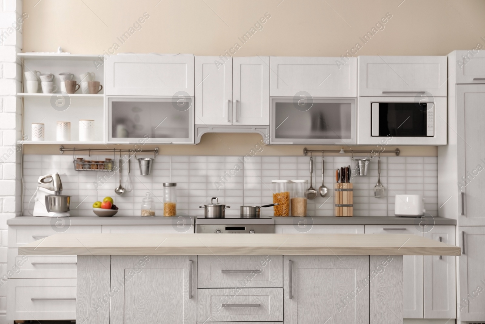 Photo of Modern kitchen interior with houseware and new furniture