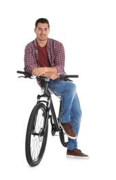 Photo of Handsome young man with modern bicycle on white background