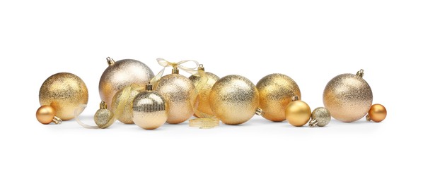Many golden Christmas balls isolated on white