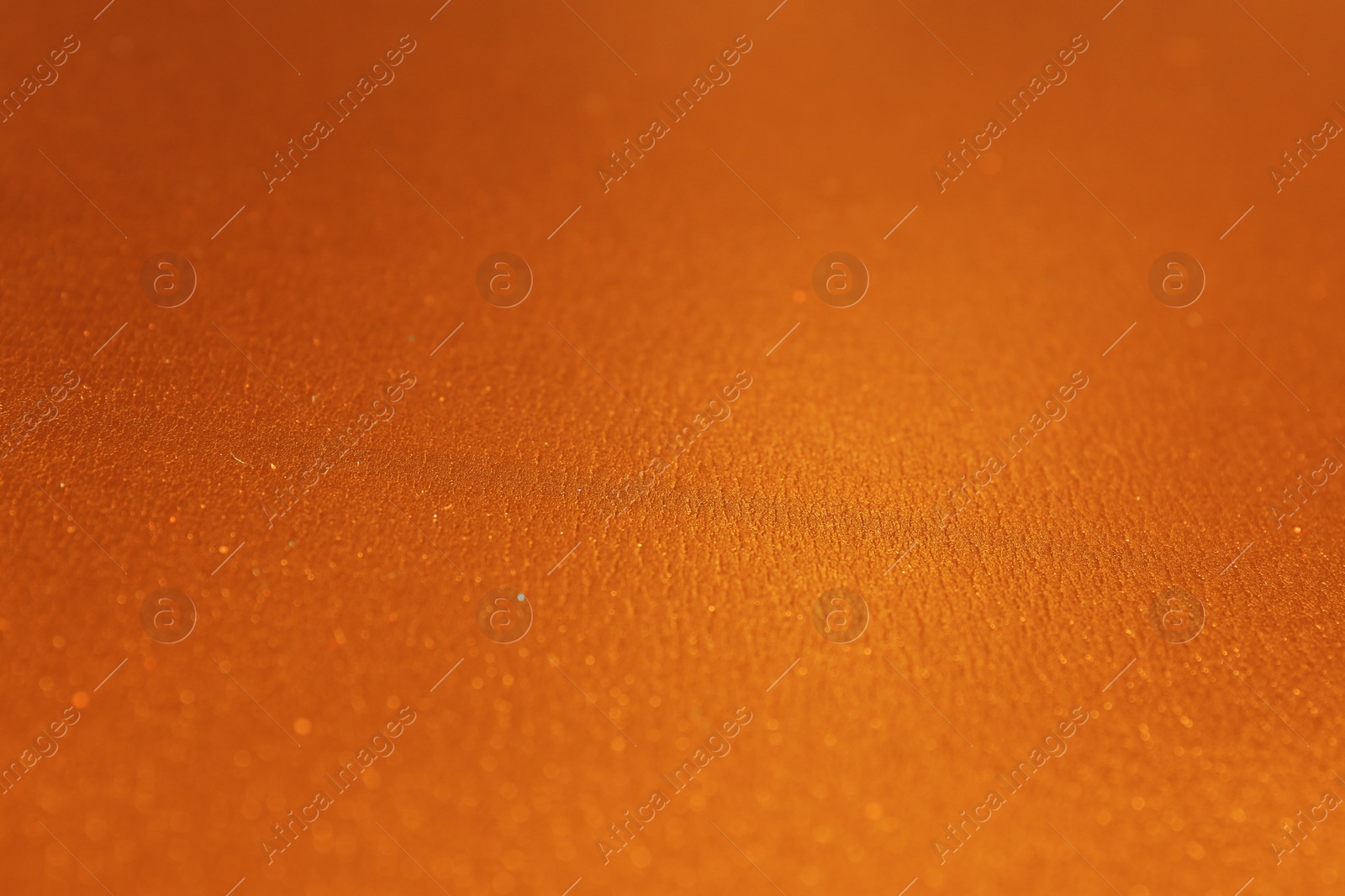 Photo of Golden textured surface as background, closeup view